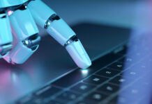 Ahrefs: Το 97% των llms.txt αρχείων δεν δέχτηκε κανένα request Robotic hand pressing a keyboard on a laptop. Cyborg fingers using a computer. 3D rendering