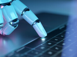 Ahrefs: Το 97% των llms.txt αρχείων δεν δέχτηκε κανένα request Robotic hand pressing a keyboard on a laptop. Cyborg fingers using a computer. 3D rendering