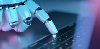 Ahrefs: Το 97% των llms.txt αρχείων δεν δέχτηκε κανένα request Robotic hand pressing a keyboard on a laptop. Cyborg fingers using a computer. 3D rendering